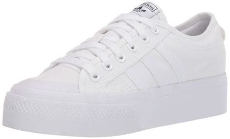 all white adidas trainers|adidas white platform trainers.